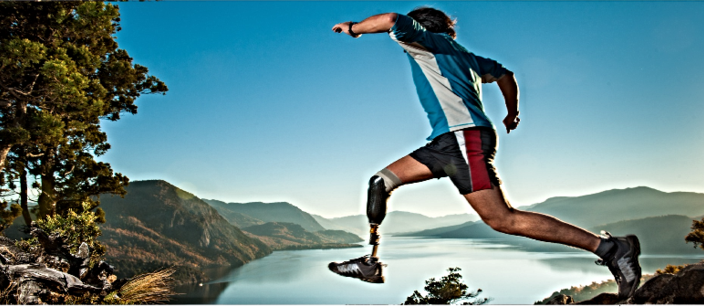 Runner with a prosthetic leg leaping above a mountain lake